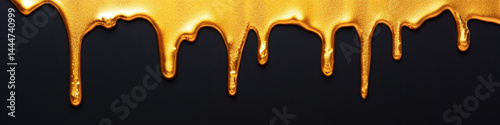 Gold drip over black background metallic liquid texture abstract art luxury style shiny surface creative design elegant and modern dramatic mood closeup detail