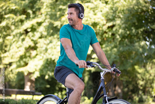 man on bicycle listening to music on headphones
