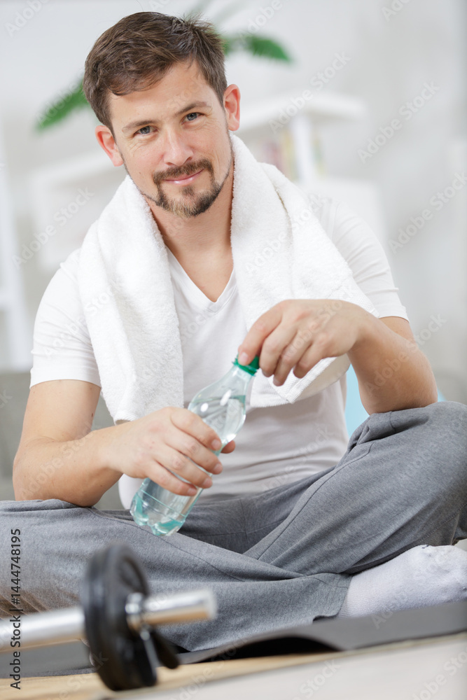 handsome sporty man resting after exercise
