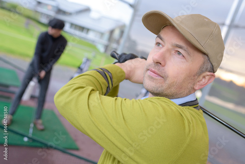 Obraz na płótnie close up of golfer training inside w salonie