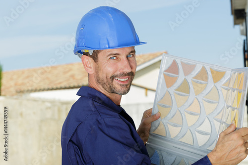 window builder installing a glass