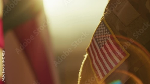 American Military Looks At American Flag On Memorial Day Celebration At Sunset
