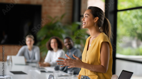 A confident woman pitching her tech startup at a morning conference