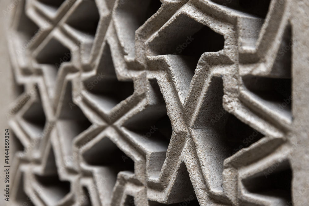 Close up of Arabic geometric pattern featuring interconnected symmetries