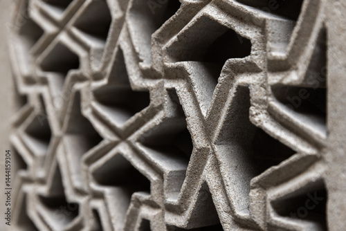 Obraz na płótnie Close up of Arabic geometric pattern featuring interconnected symmetries w salonie