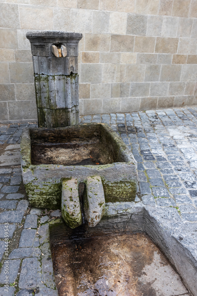An ancient stone fountain with drinking water, Baku, Azerbaijan