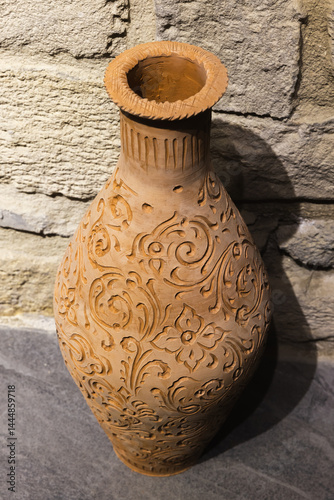 Obraz na płótnie An ornamental ceramic vase featuring elaborate floral carvings w salonie