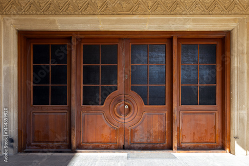 Obraz na płótnie Beautiful wooden double doors featuring a symmetric geometric pattern w salonie