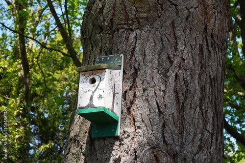 bird house on tree in garden. small bird box