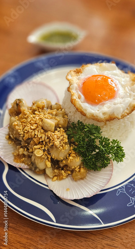 Obraz na płótnie Stir-fried Scallops with garlic with streamed rice serving on blue plate w salonie