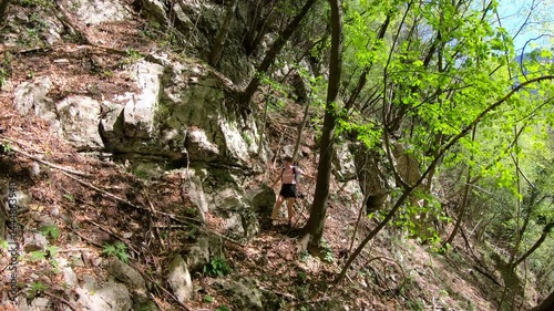 adventurous girl has lost her path in the thick of the bush and struggles to continue