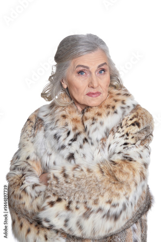 Obraz na płótnie portrait of sad beautiful senior woman in fur coat w salonie