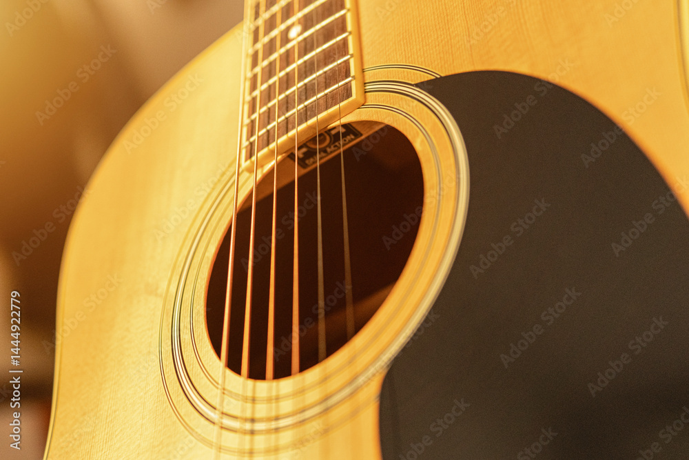 Obraz premium close-up of an expensive-looking acoustic guitar 