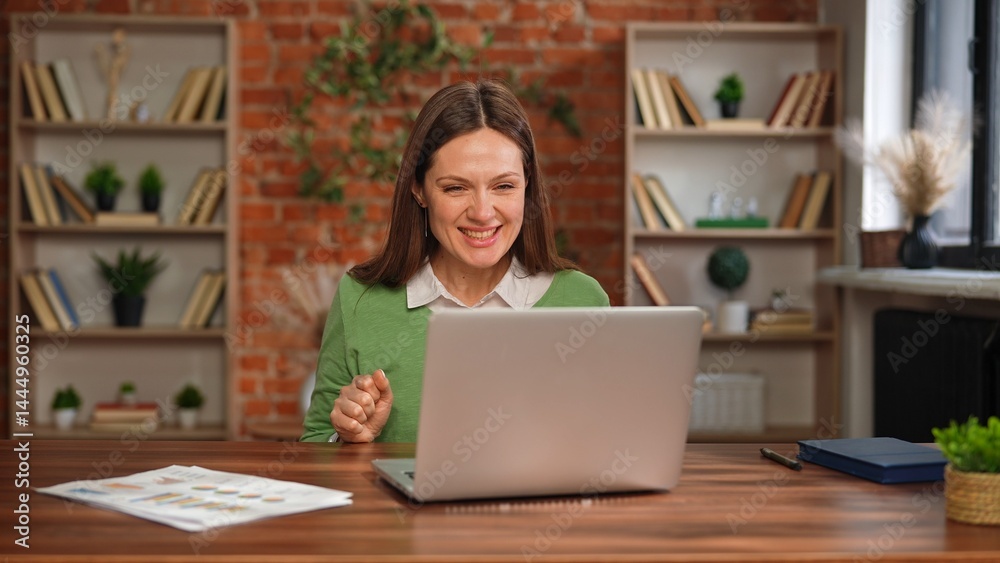 Woman Experiences Joy While Working at Home Desk Woman Experiences Joy While Working at Home Desk