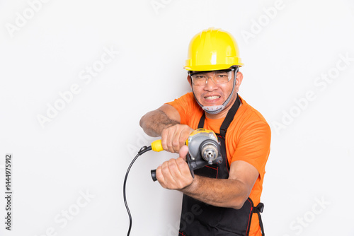 Portrait worker in black uniform with electric drill isolated on white background.