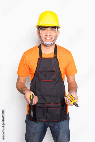 Portrait worker in black uniform with screwdriver and pliers isolated on white background.