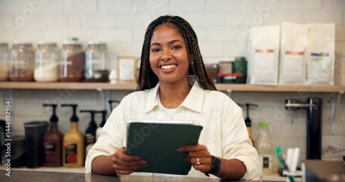 Smile, portrait and woman on tablet at cafe for menu update, online orders and inventory management. African person, digital and shop website, review stock and checklist report of hospitality service