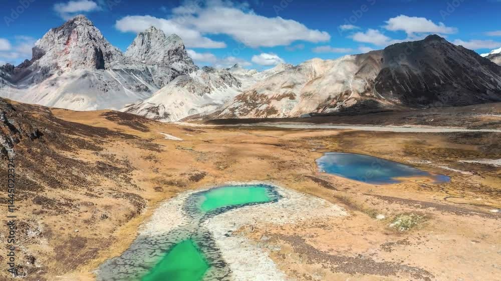 Aerial View of Turquoise Lake and Mountain Range in High Altitude Desert Aerial View of Turquoise Lake and Mountain Range in High Altitude Desert