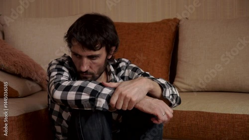 a man immersed in sad thoughts, Hopelessness, a desperate man, unemployed, jobless, the economic crisis, sadness, personal problems, loneliness