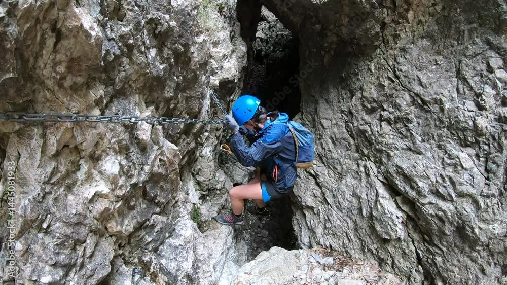 A solo adventurer navigates a dizzying traverse on the Caminetto via ferrata, suspended high on Resegone’s rocky north face near Lecco. A solo adventurer navigates a dizzying traverse on the Caminetto via ferrata, suspended high on Resegone’s rocky north face near Lecco.