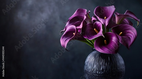 Elegant purple calla lilies in vase