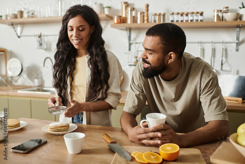 Enjoying a cozy morning together while preparing a delicious breakfast at home photo