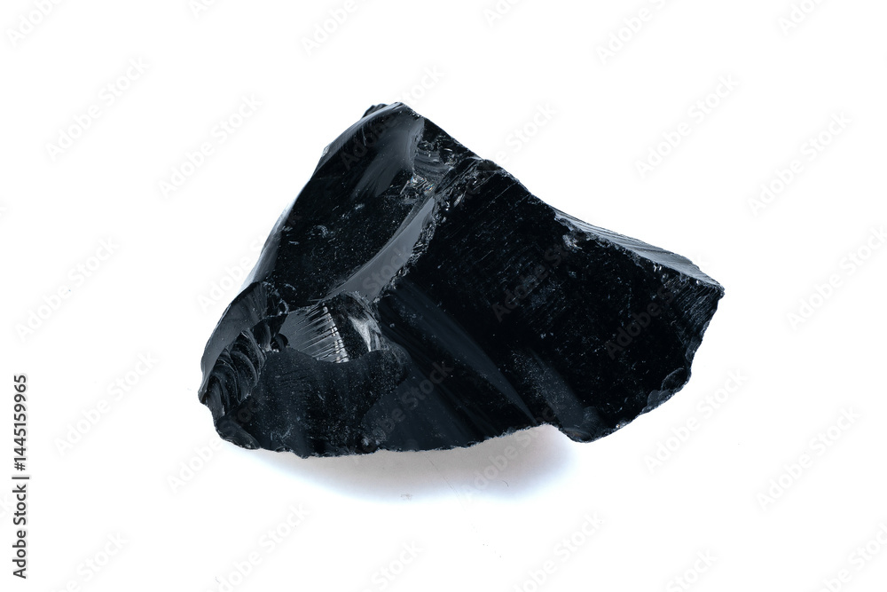 Natural form of raw black obsidian volcanic rock isolated on white background