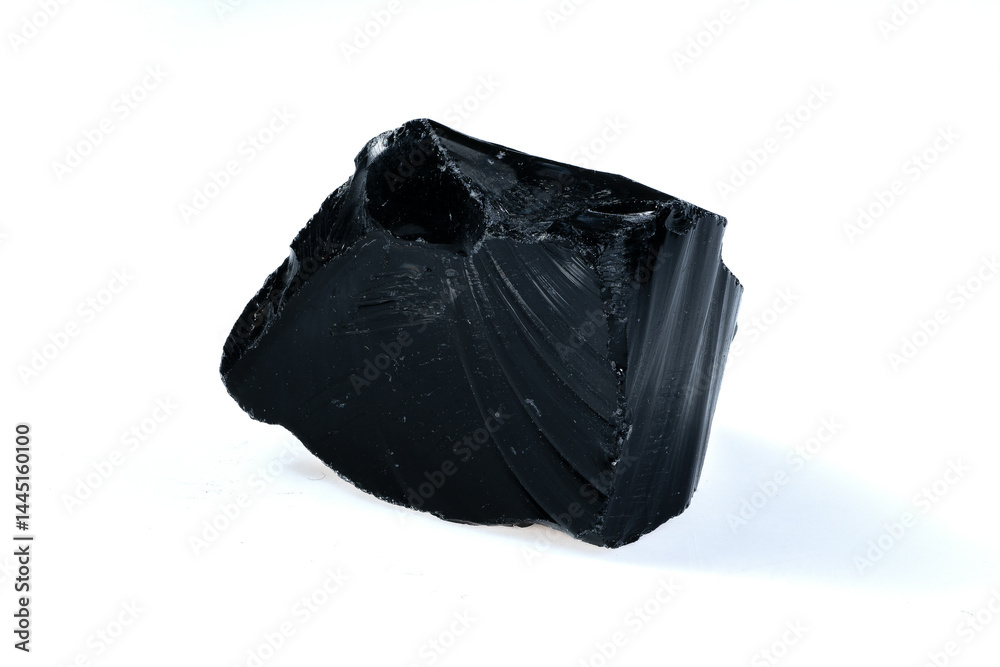 Natural Black Volcanic Obsidian Stone Fragment Isolated on White Background