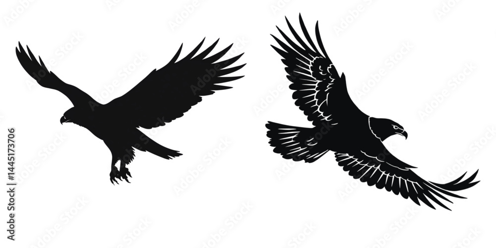 Obraz premium Two silhouette eagles soaring majestically with outstretched wings wide