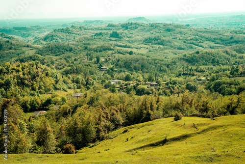 Sunset over hills landscape. Beautiful idealistic summer evening landscape somewhere in Europe