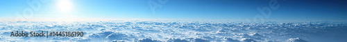 A breathtaking view of the endless blue sky and clouds, evoking peace and tranquility in nature's vastness.