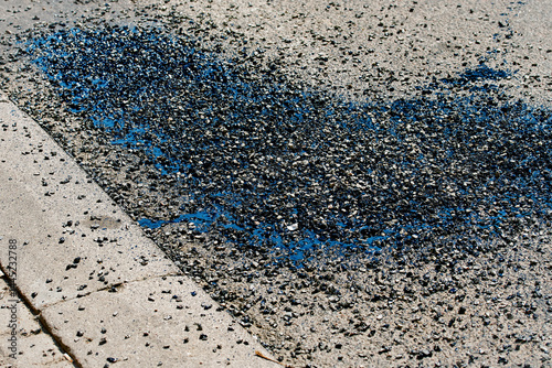 Obraz na płótnie Asphalt crack sealing with bitumen, gravel and resin material during street repair, urban maintenance work for long-term road surface protection. Bitumen and gravel mix for repair asphalt road w salonie