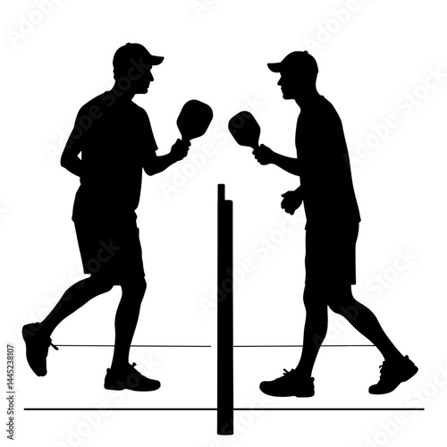 Players competing at pickleball net, sporting challenge