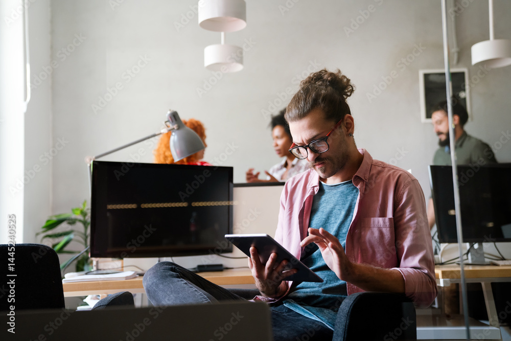 Leadership, tablet and hipster startup programmer CEO or manager in the office. Technology planning.