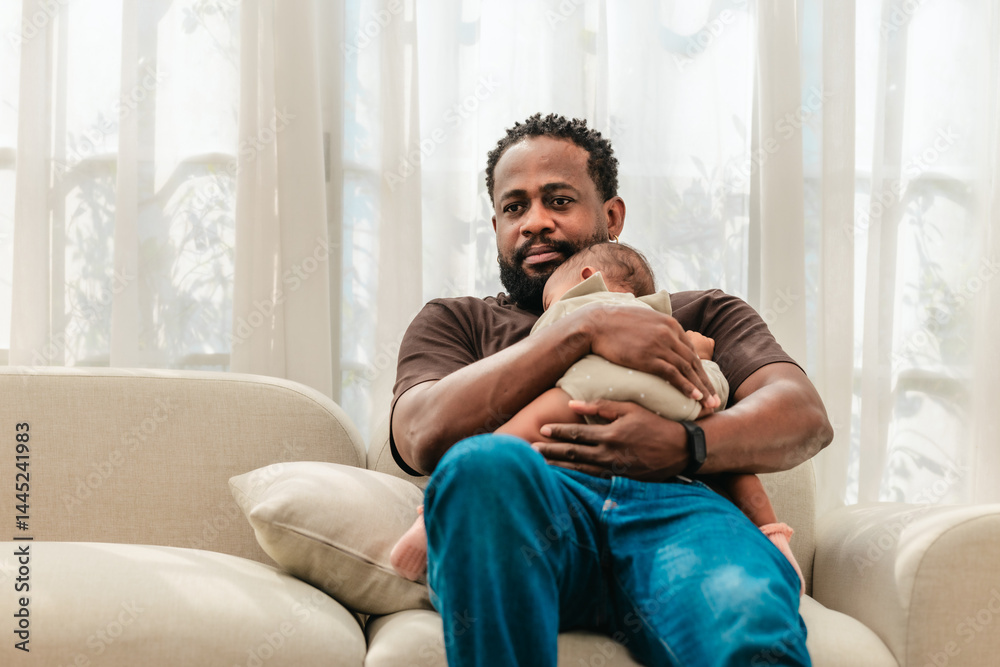 Obraz premium Loving Black Father Holding Baby.
