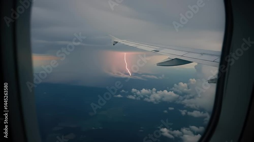 Aviation spectacle: A daring aerial perspective of a powerful lightning strike during flight