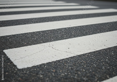 Obraz na płótnie Zebra pedestrian crossing on asphalt road surface close up. Safety concept for pedestrian and driver on urban road. Use for road safety education poster w salonie
