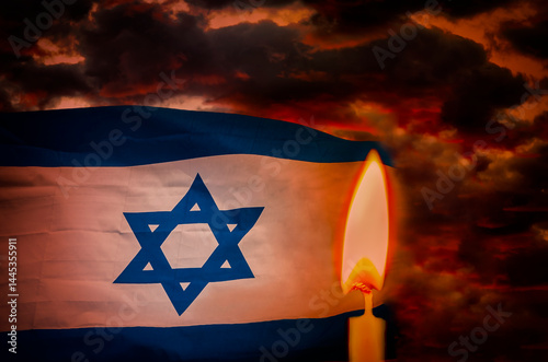 Memorial day  or Day of Remembrance for All the Fallen. Flag with Star of David and lit candle. Dramatic sky background. Only my own photos and traditional digital tools were used