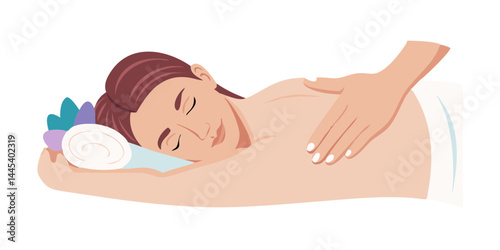 Calm woman lying during wellness back massage