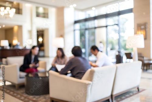 Professional team meeting in hotel lobby with engaging discussions in modern atmosphere