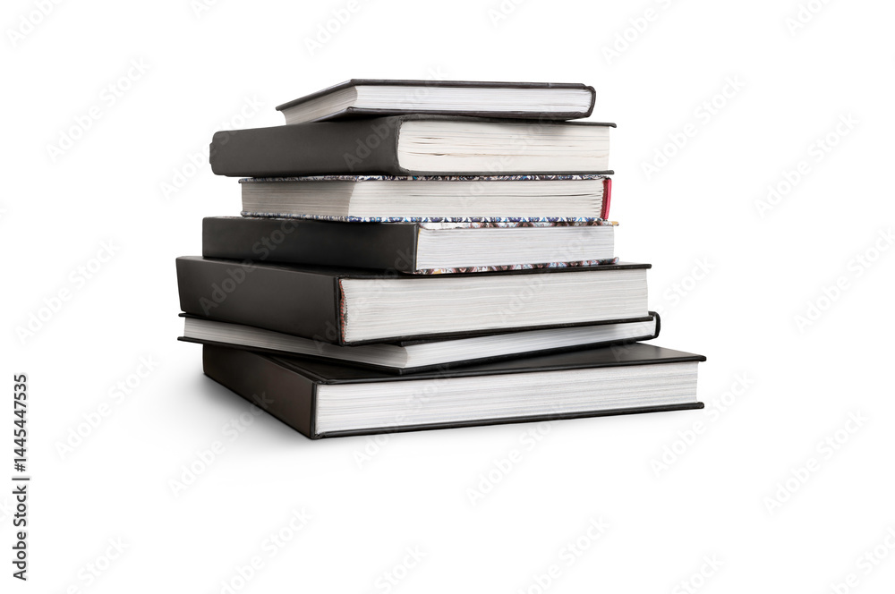 A front side on view of a pile of seven study books, textbooks, on a table isolated against a transparent background
