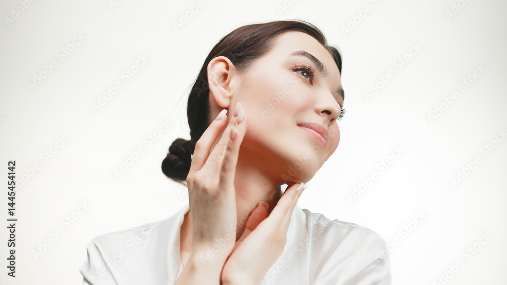Positive laughing portrait of a beautiful woman enjoying beauty serum on isolated background. Facial skin care concept. Positive laughing portrait of a beautiful woman enjoying beauty serum on isolated background. Facial skin care concept.