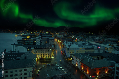 Bodø, a city north of the Arctic Circle, offers stunning views of the aurora borealis. The Northern Lights dance across the night sky, creating a magical spectacle.
