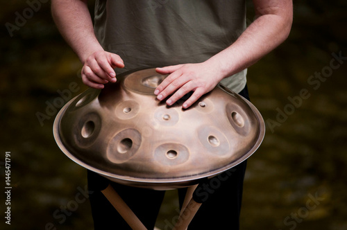 handpan outdoors near a waterfall