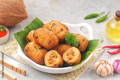Combro is made from grated cassava which is shaped round or oval and filled with oncom and chili sauce and then fried.