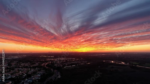 Breathtaking Sunset Over Urban Landscape with Colorful Sky Display
