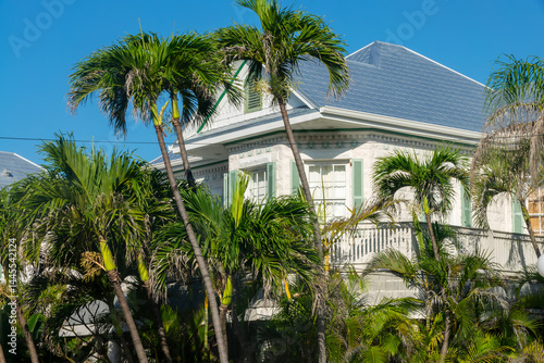 Old neoclassic victorian house with tropical backyard, architecture in Key West, Florida
