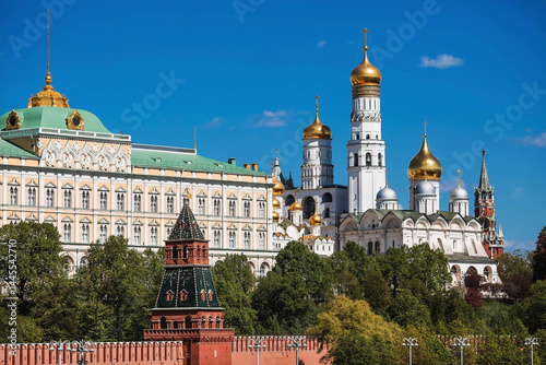 Moscow on a sunny day. The Grand Kremlin Palace, the Annunciation Cathedral, the Archangel Cathedral and the bell tower of Ivan the Great on the Kremlin embankment. The business card of Moscow.