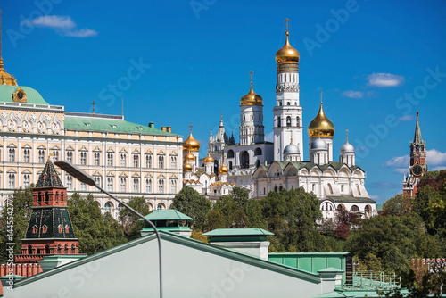 Moscow on a sunny day. The Grand Kremlin Palace, the Annunciation Cathedral, the Archangel Cathedral and the bell tower of Ivan the Great on the Kremlin embankment. The business card of Moscow.
