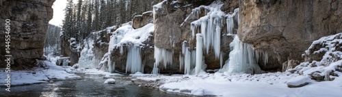 Icicles form around the winter waterfall, transforming it into a frozen wonderland